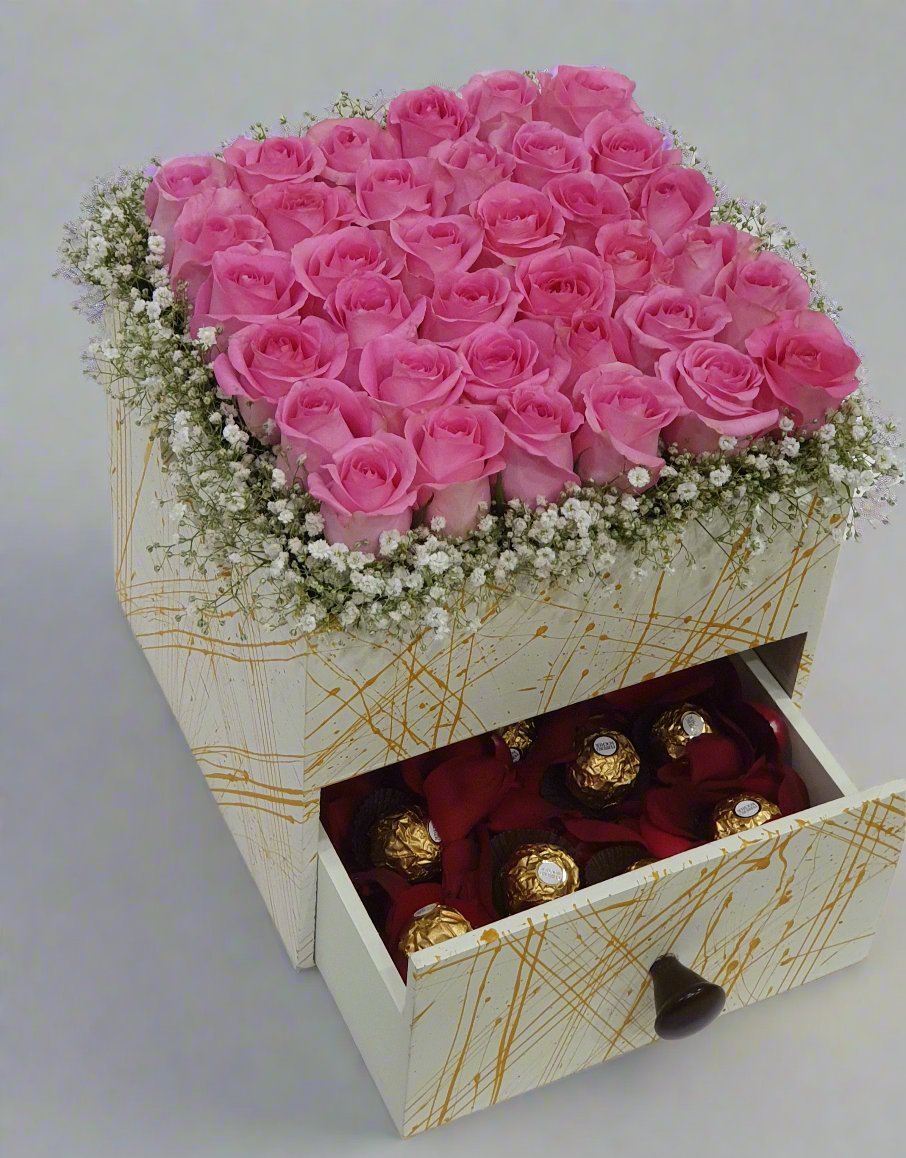 Gift a chic square box with 36 pink roses and Ferrero Rocher chocolates—a perfect blend of elegance, sweetness, and charm for any occasion.