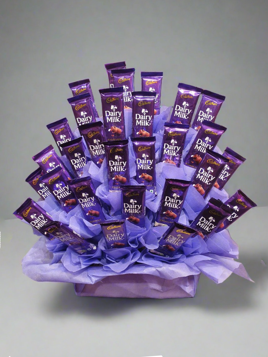 Discover the perfect gift a basket of Dairy Milk chocolates, offering rich flavours and delightful sweetness for every occasion.