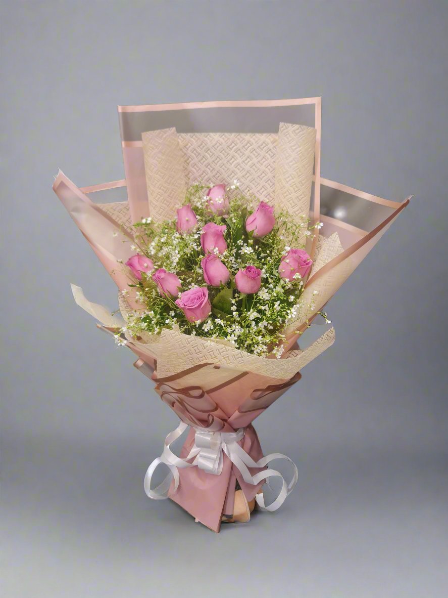 Elegant bouquet of pink roses with baby's breath – perfect for weddings, anniversaries, or gifts. Fresh, vibrant, and beautifully arranged.