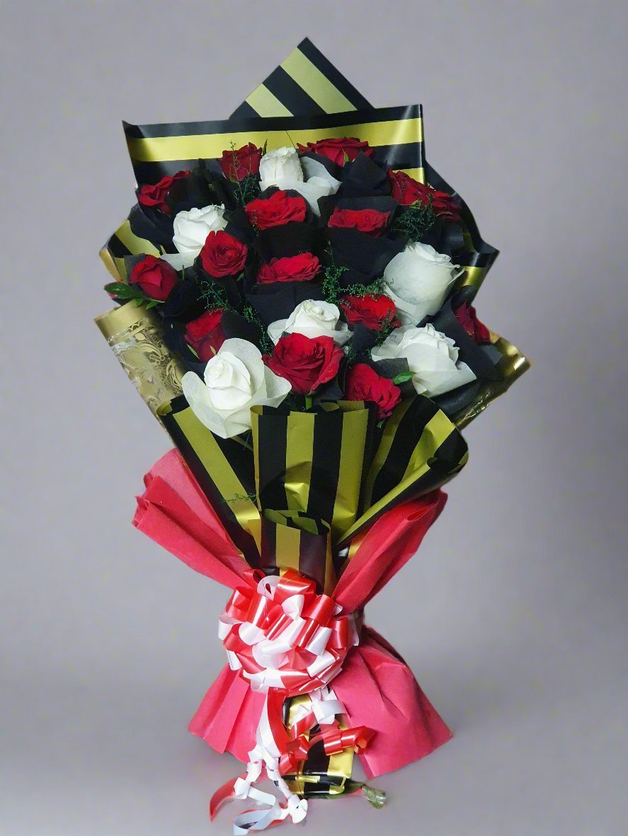 Discover a breathtaking bouquet of red and white roses wrapped in dark green and white paper—perfect for gifting with elegance and love.