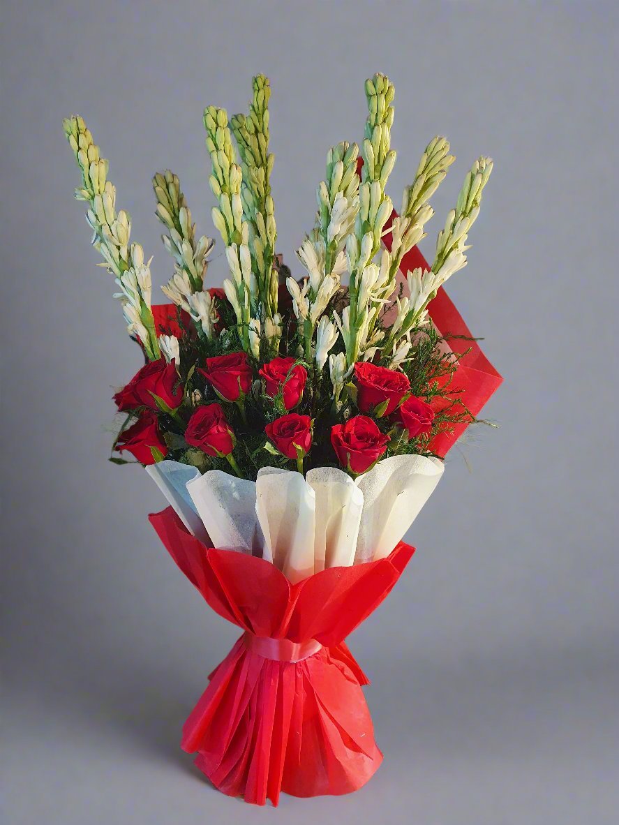 Exquisite red roses nestled among lush green tuberoses, perfect for adding elegance to any occasion. Fresh, vibrant, and timeless beauty.