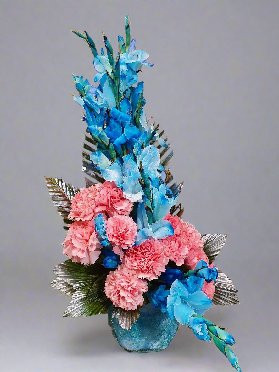 Elegant floral arrangement with soft pink carnation roses and vibrant sky blue gladiolus, exuding sophistication and charm. Perfect for any occasion.