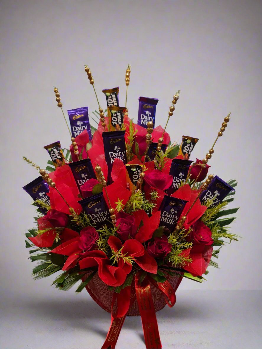 In a stunning arrangement of 15 Dairy Milk chocolates paired with vibrant red roses, ideal for gifting on special occasions.