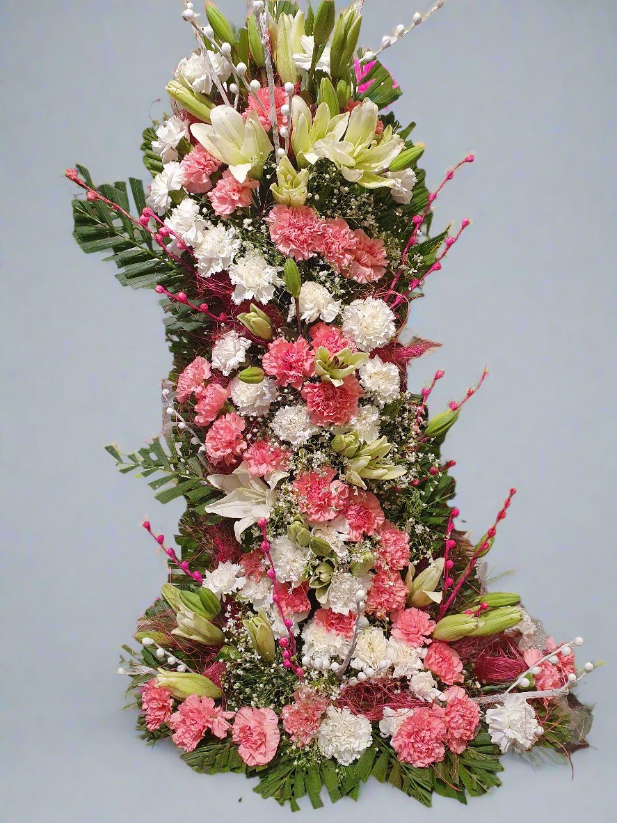 Celebrate the holidays with a stunning carnation Christmas tree. A unique floral gift and centerpiece for your festive season