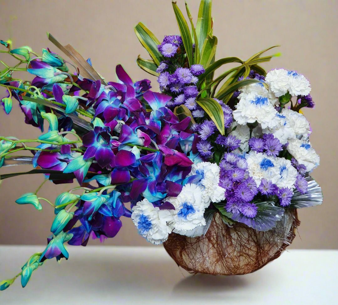 Dark purple roses and white-purple carnations with lush green leaves in a stylish pot. A perfect blend of elegance and sophistication.