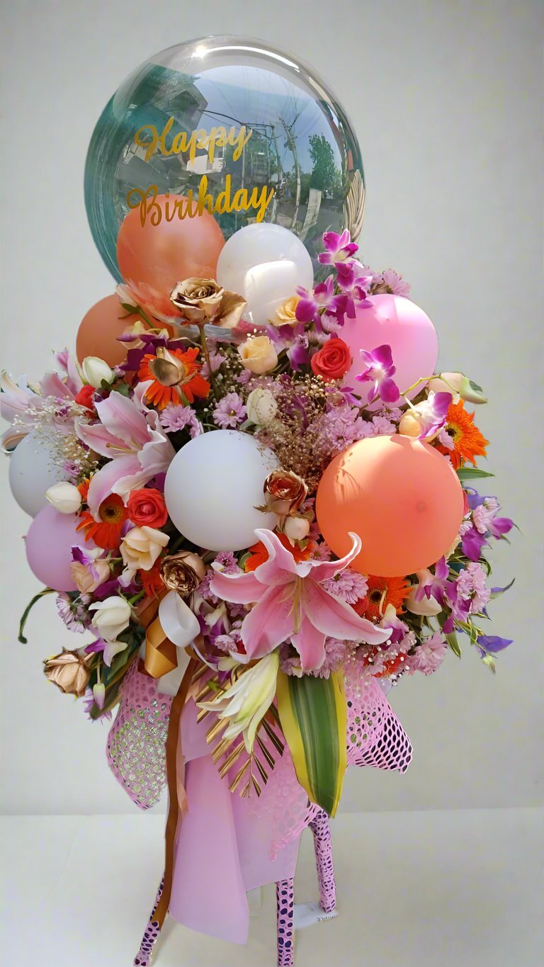 Delightful bouquet with premium roses, lilies, daisies, and vibrant balloons, perfect for celebrations. Unique gift for any occasion!