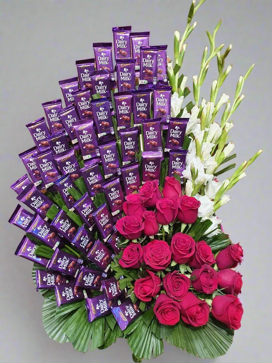 Delight loved ones with vibrant red roses & rich Dairy Milk chocolates. A perfect gift for love, friendship, & unforgettable moments.