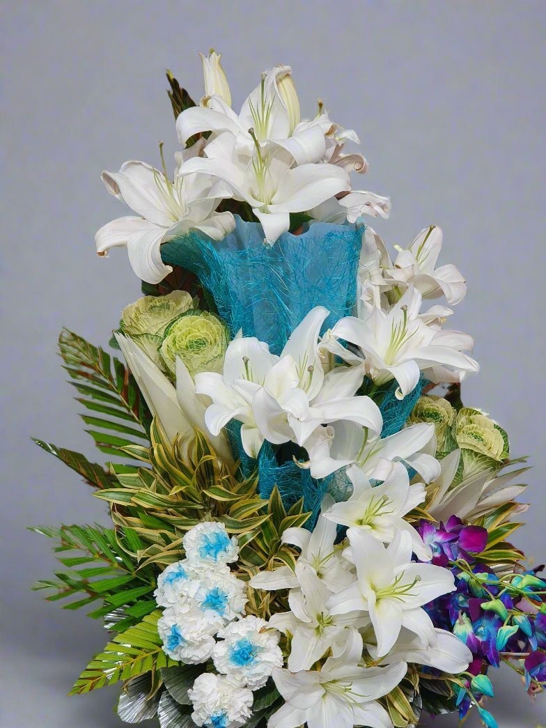 Discover the stunning combination of white carnations, white lilies, and blue orchids for an elegant floral arrangement. Perfect for any occasion!