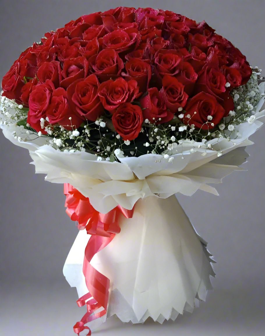 Beautiful red roses bouquet with lush green leaves, elegantly wrapped in white sheet, perfect for any special occasion or celebration.