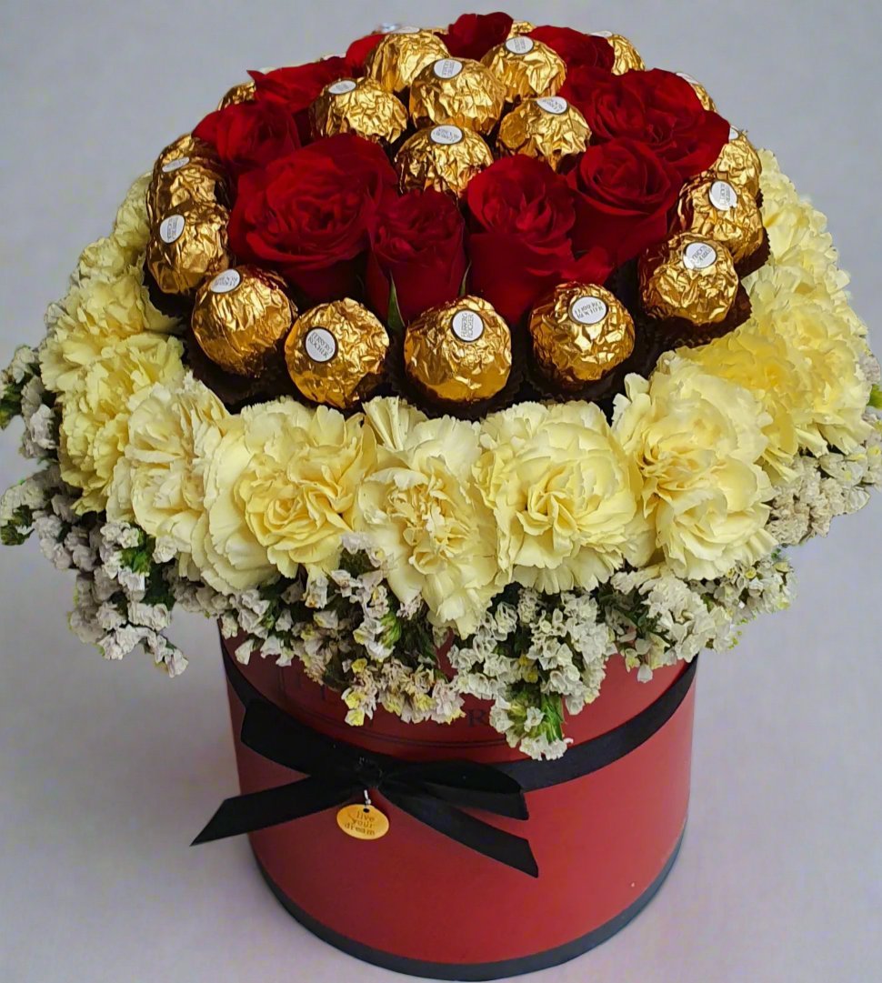 Make every celebration unforgettable with a stunning arrangement of red roses and delicious Ferrero Rocher chocolates.