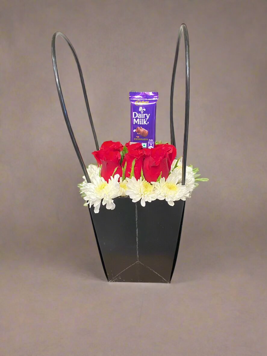 Send love with red roses and Dairy Milk chocolate in a stylish black box. Perfect gift for any occasion.