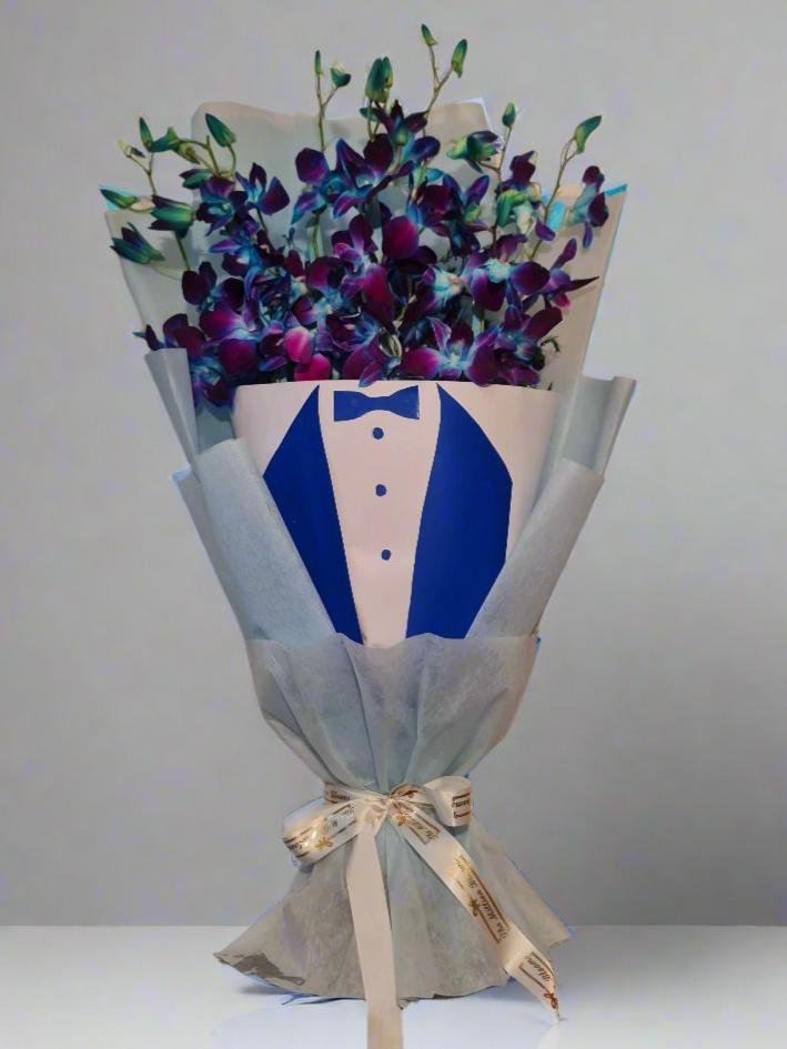 Elegant bouquet featuring stunning blue orchids, perfect for special occasions. Unique floral arrangement with vibrant hues and lasting beauty.