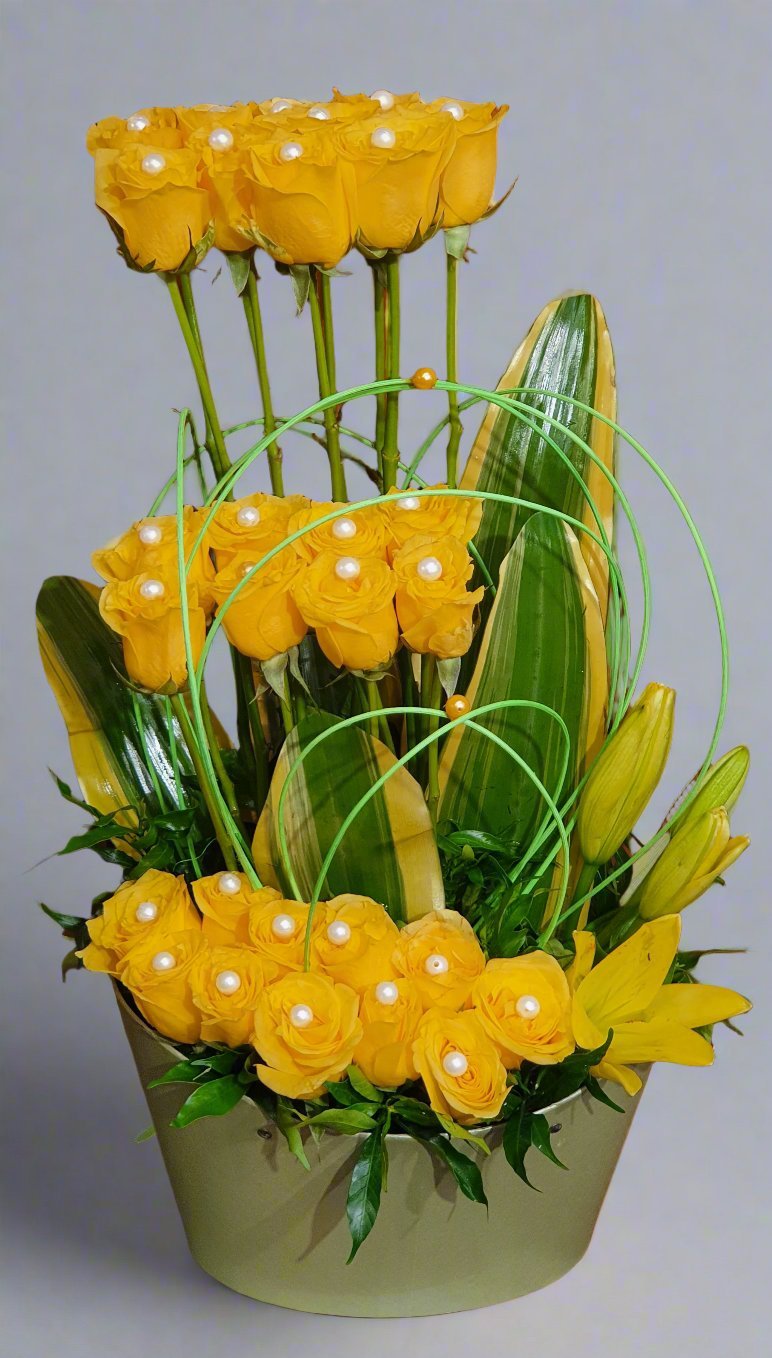 A stunning arrangement of yellow and green flowers in a chic green box, perfect for any occasion. Bright, cheerful, and full of life